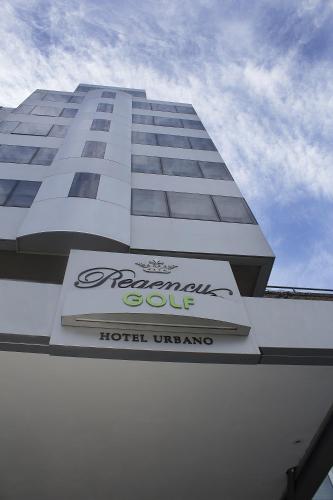 a building with a sign on the side of it at Regency Golf - Hotel Urbano in Montevideo
