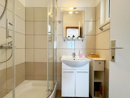 a bathroom with a sink and a shower at Hvar Sunny hill in Hvar