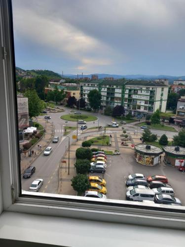 a view of a parking lot with cars parked at Apartmani Loznica in Loznica