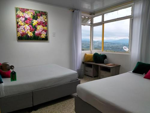 Postel nebo postele na pokoji v ubytování ZIVÁ HOSTAL