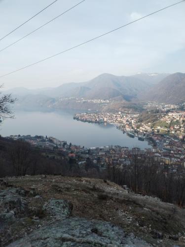 a view of a body of water from a mountain at un balcone sul lago in Omegna