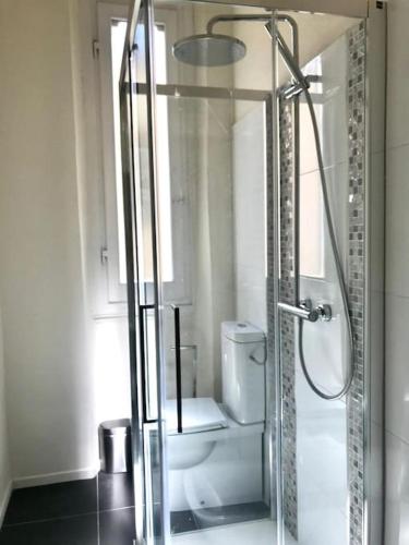 a bathroom with a glass shower with a toilet at La nicchia dei sogni in Montevarchi