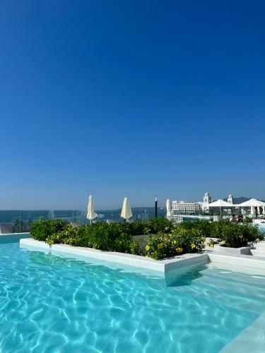 a view of a swimming pool at a resort at Marítima Golf Apartment Steps from the Beach in Bucerías