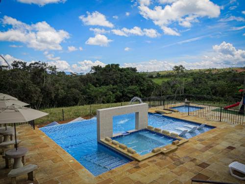 a swimming pool with a pool at Hotel Campestre Ataraxia Barichara in Barichara