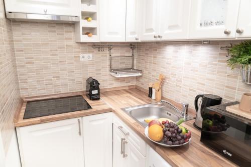 A kitchen or kitchenette at Bakáts Square Luxury Apartment