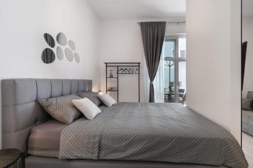 Ένα ή περισσότερα κρεβάτια σε δωμάτιο στο Apartments Angelo