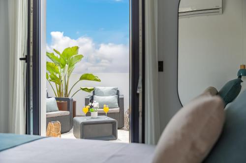 a person is looking out the window of a bedroom at Stay Belonio in Málaga