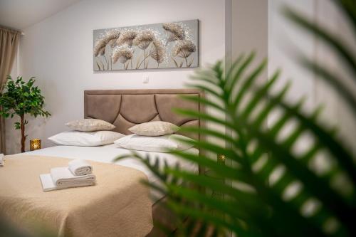Postel nebo postele na pokoji v ubytování Apartmani Rita