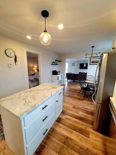 a kitchen with a counter top and a refrigerator at Rural Town Oasis in Bonavista