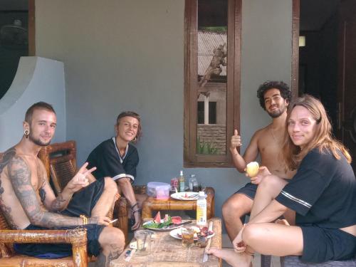 a group of people sitting around a table at T&T Homestay in Kuta Lombok