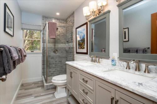 a bathroom with a sink and a toilet and a shower at Wawona Home in Wawona
