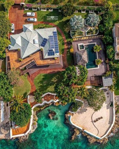 an aerial view of a house with a swimming pool at Villa Gilgal in Kings Pen