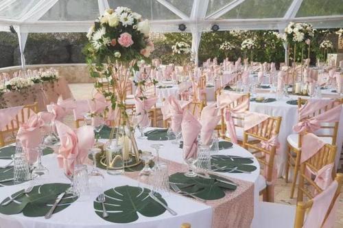 a table set up for a wedding in a marquee at Villa Gilgal in Kings Pen