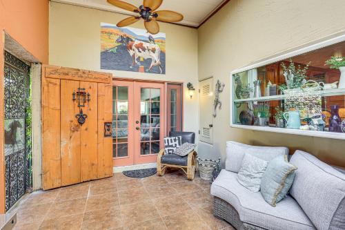 a living room with a couch and a ceiling fan at Redlands Home with Community Perks 1 Mi to Downtown in Redlands