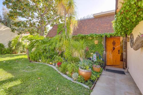 a house with a yard with plants and a door at Redlands Home with Community Perks 1 Mi to Downtown in Redlands