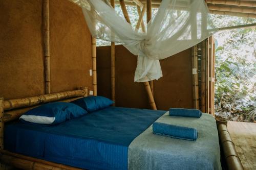 מיטה או מיטות בחדר ב-Finca La Selvita