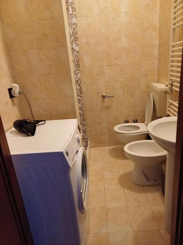 a bathroom with two toilets and a sink at Locazione turistica Ani in Novara