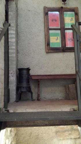 a room with a bench and a painting on the wall at La Torretta - Cerreto Grue in Sarezzano