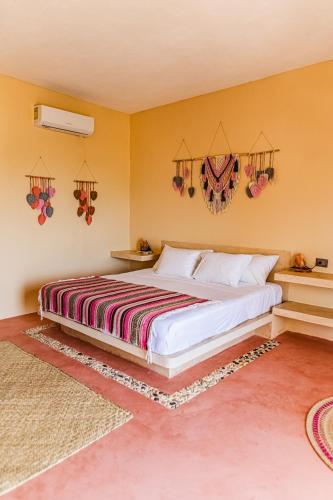 Ein Bett oder Betten in einem Zimmer der Unterkunft Atenea Holbox