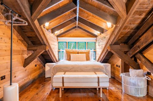 a bedroom with a bed in a attic at Stunning Couples Retreat Lodge in Milford