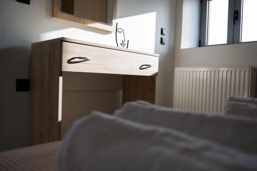 a wooden dresser in a bedroom with a window at Villa Arancia in Argos