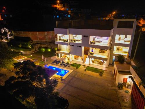 an aerial view of a building at night at Silver Inn Hotel in Cerro Azul