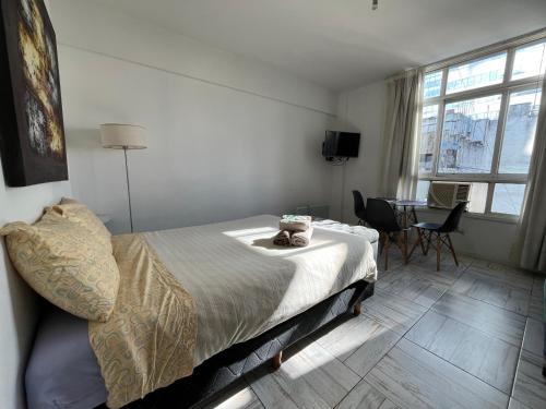 Ένα ή περισσότερα κρεβάτια σε δωμάτιο στο Center Apartment Studio