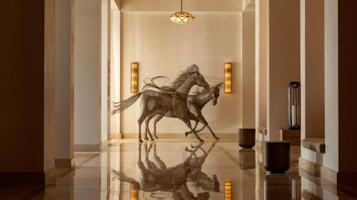 a statue of a horse on display in a museum at InterContinental Fujairah Resort by IHG in Al Aqah