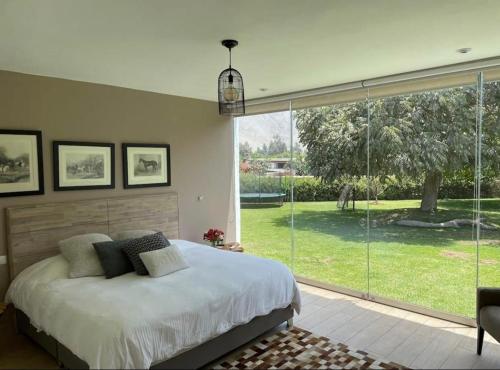 Postel nebo postele na pokoji v ubytování Alquiler Casa de Campo Cieneguilla Exclusiva