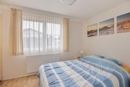 מיטה או מיטות בחדר ב-Polderpark 190
