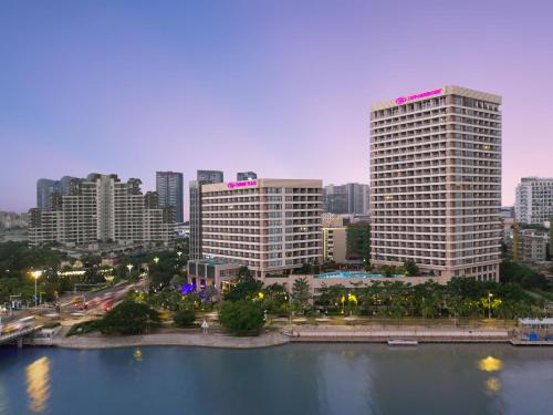 a city with tall buildings and a body of water at Crowne Plaza Sanya City Center, an IHG Hotel in Sanya