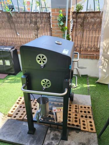 a grill sitting on the ground in a yard at Urban forest #terminal 5min #baseball stadium 2min in Gwangju
