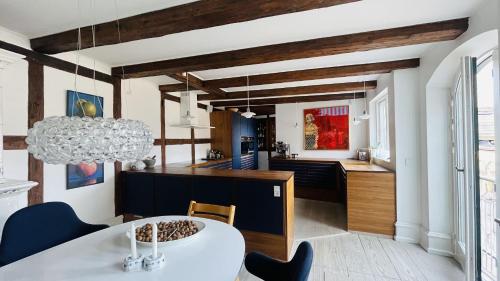 a kitchen and dining room with a table and chairs at ApartmentInCopenhagen Apartment 1631 in Copenhagen