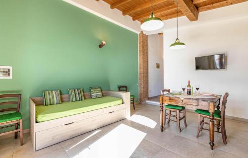 a room with a bed and a table and a table and chairs at Casa Muzzi Verde in Casole dʼElsa