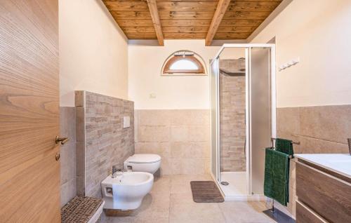 a bathroom with a shower and a toilet and a sink at Casa Muzzi Verde in Casole dʼElsa