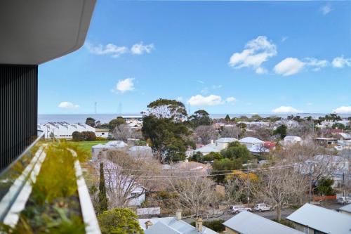 a view of the city from the balcony of a house at 1 Bedroom Apartment With Parking Close To Beach in Williamstown