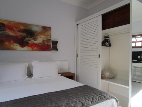 Ilha flat Hotel Suíte Swaenen II tesisinde bir odada yatak veya yataklar