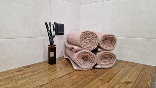a pile of towels sitting on the floor in a bathroom at Niinepesa in Haapsalu