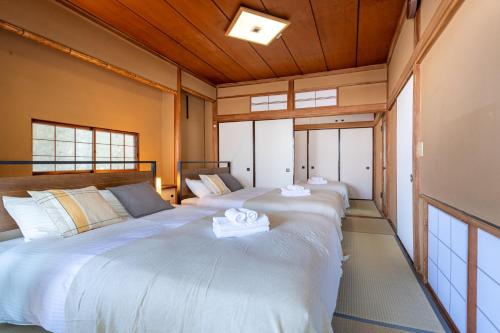 En eller flere senge i et værelse på Villa Katsushikaお花茶屋駅徒歩10分