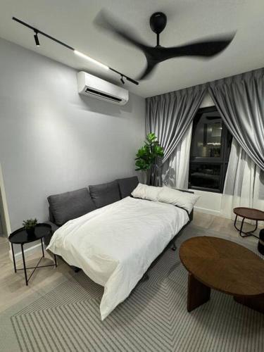 a bedroom with a bed and a ceiling fan at M Vertica Residence in Kuala Lumpur