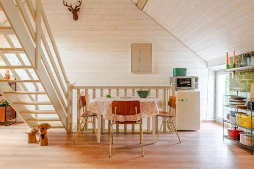 a kitchen with a table and chairs in a room at Countryside Cottage samois-sur-seine in Samois-sur-Seine