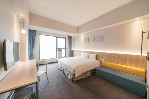 Postel nebo postele na pokoji v ubytování Hotel Liyaou