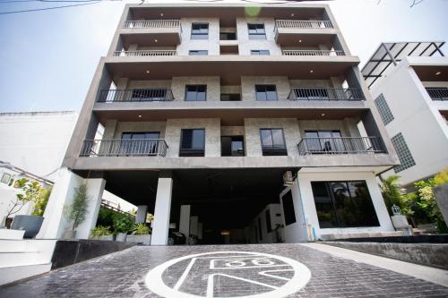 a building with a no parking sign in front of it at Room 36 service apartment in Bangkok