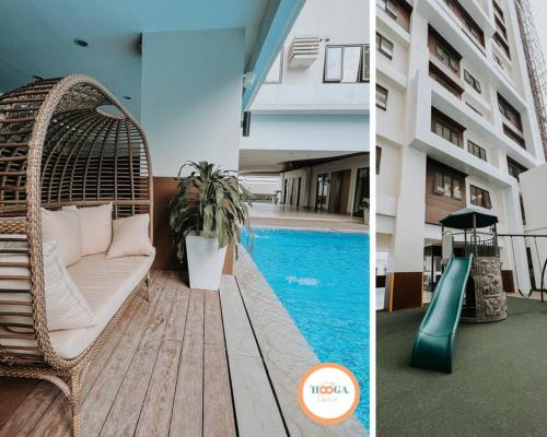 eine Korbschaukel neben einem Pool in der Unterkunft Hooga Home Be Residences Near IT Park in Cebu City