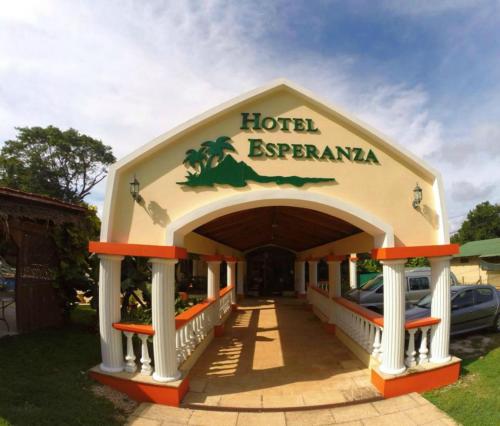 a hotel entrance with a hotel exremania sign on it at Hotel Esperanza in Carrillo