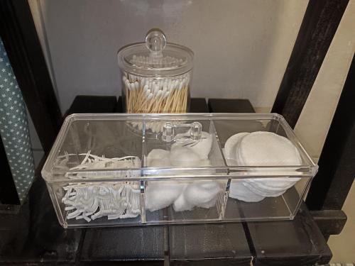 a clear container filled with vegetables on a table at Dalau on Main in Paarl