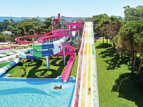 an image of a water park with a water slide at Mandola Rosa at Riviera Olympia, A Grecotel Resort to Live in Loutra Killinis