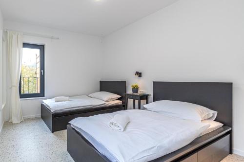 Posteľ alebo postele v izbe v ubytovaní Sapore Di Mare Apartments