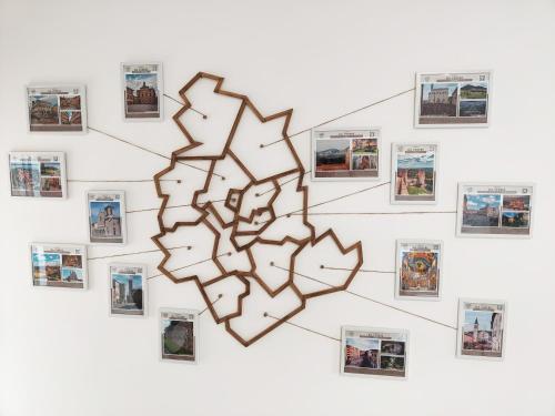 a drawing of a heart with pictures on a wall at Bastia Home Appartamento in Bastia Umbra