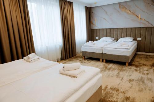 Ένα ή περισσότερα κρεβάτια σε δωμάτιο στο Hotel Przystań Przy Lesie